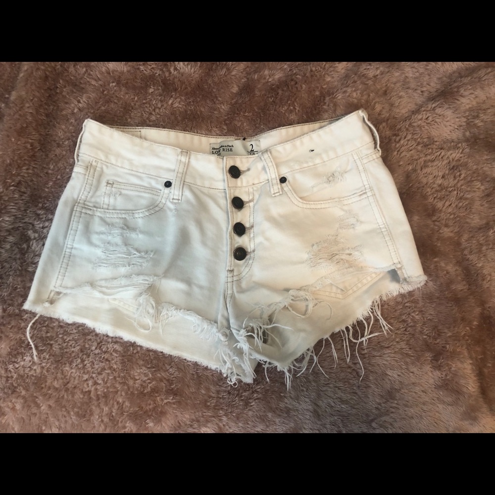 Destroyed white denim shorts